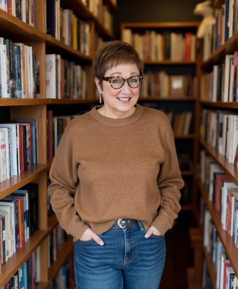 Writer Mary Yerkes in her library writing